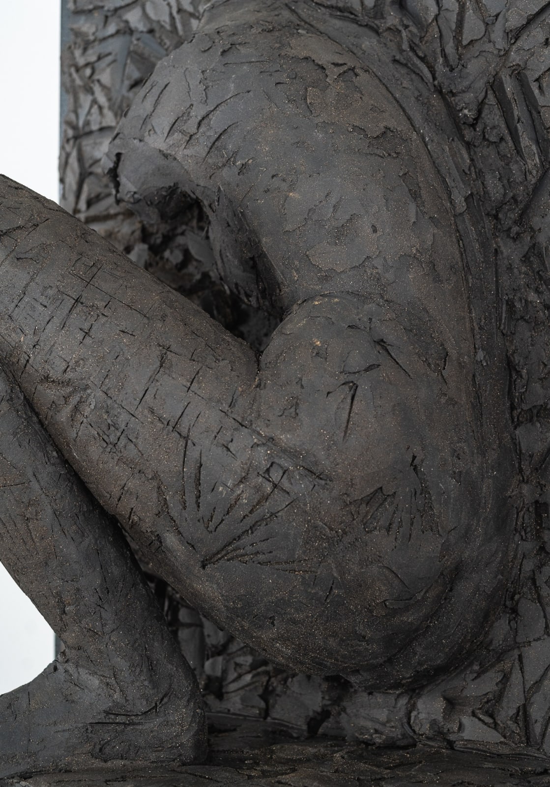 Ceramic relief in black clay in sculptor Emilio DiIorio's Women of Troy series.