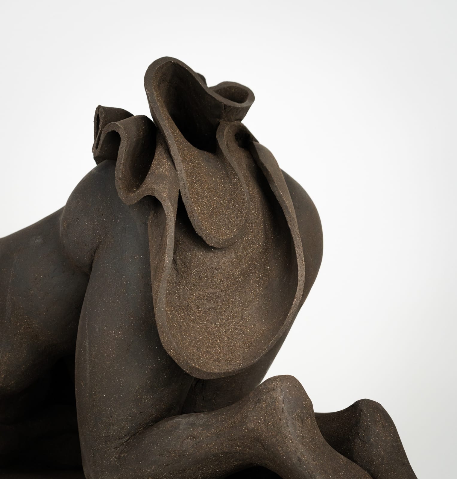 Figurative ceramics sculpture by artist Emilio DiIorio. Female figure is No. 5 in artist's Seated Bathers series in black clay.