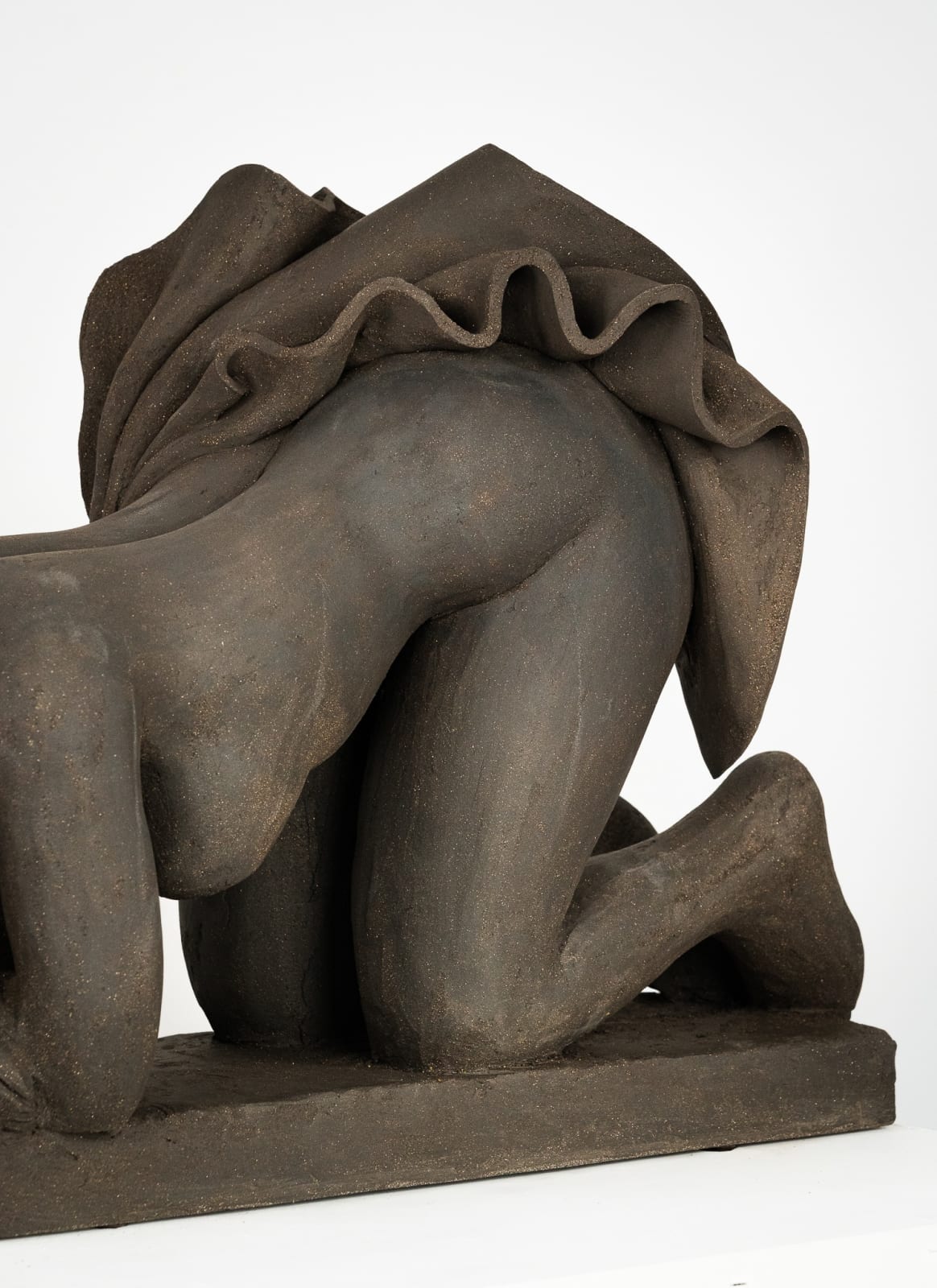 Figurative ceramics sculpture by artist Emilio DiIorio. Female figure is No. 5 in artist's Seated Bathers series in black clay.