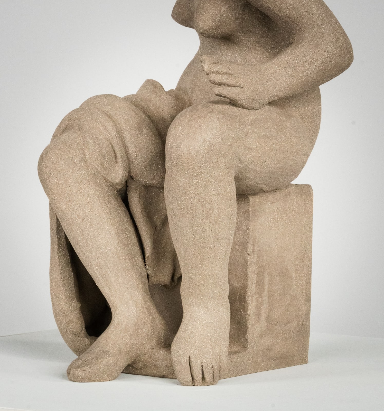 Figurative ceramics sculpture by artist Emilio DiIorio. Female figure is No. 4 in artist's Seated Bathers series in gray clay.