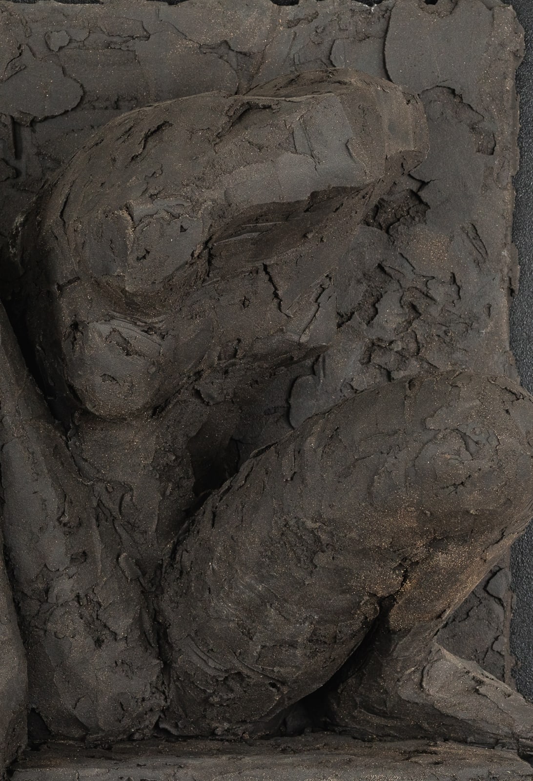 Ceramic relief in black clay in sculptor Emilio DiIorio's Women of Troy series.