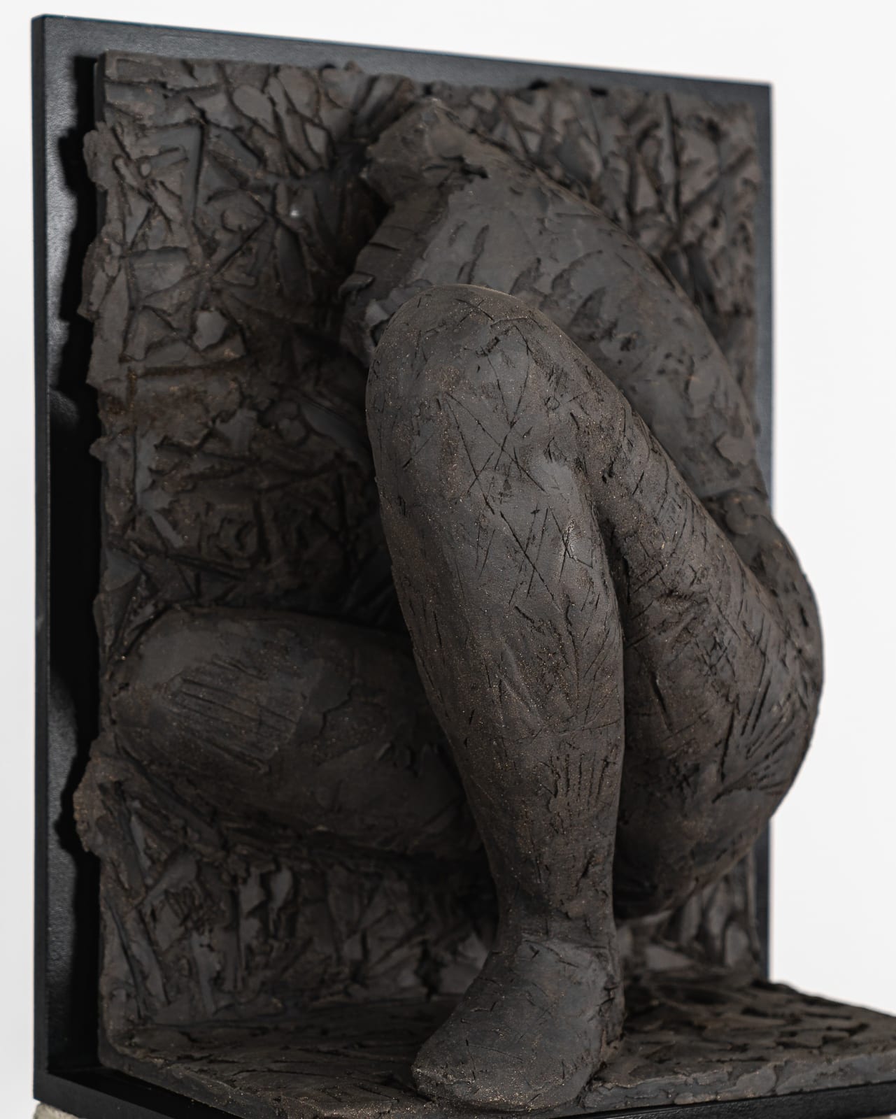 Ceramic relief in black clay in sculptor Emilio DiIorio's Women of Troy series.