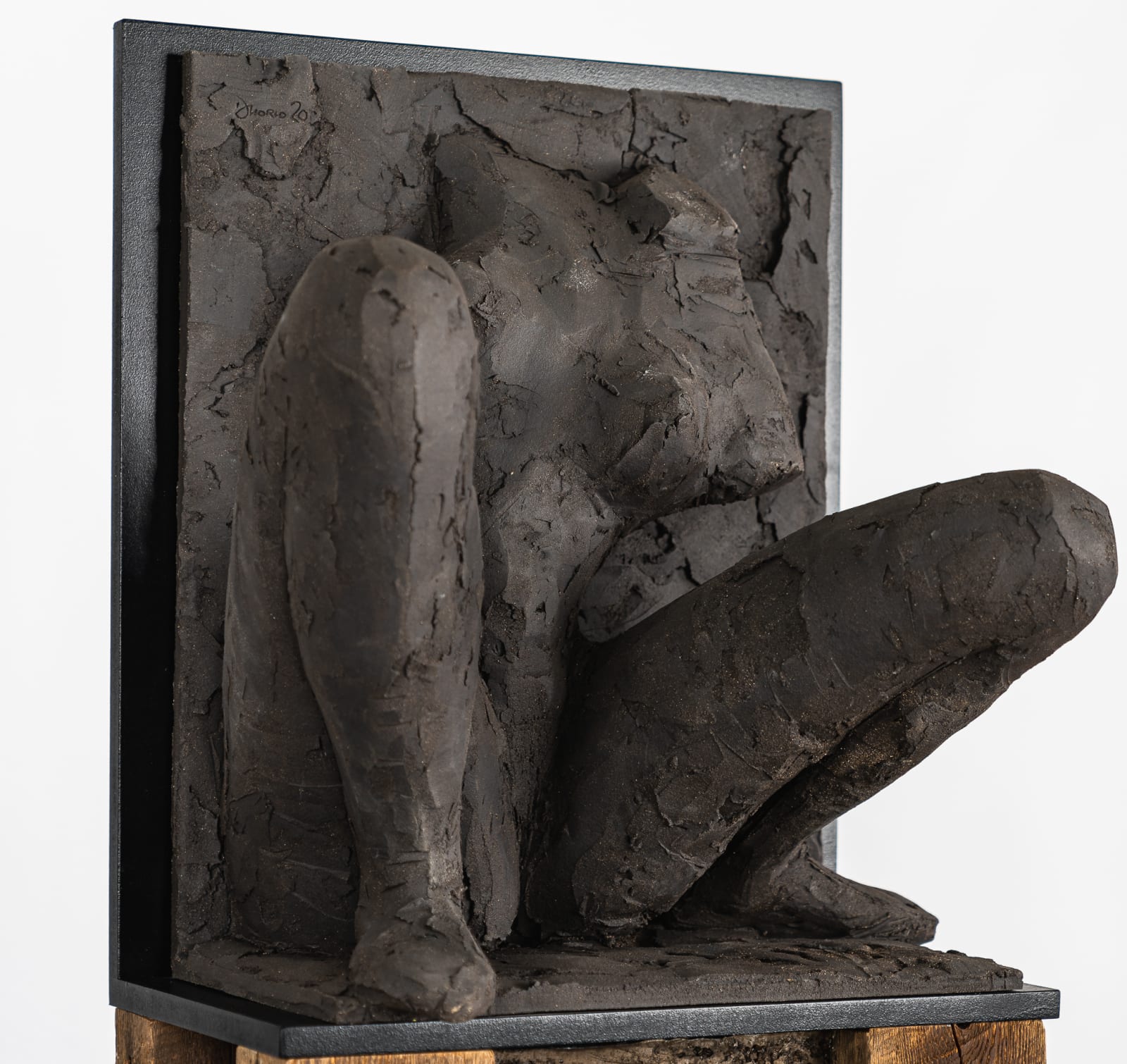 Ceramic relief in black clay in sculptor Emilio DiIorio's Women of Troy series.
