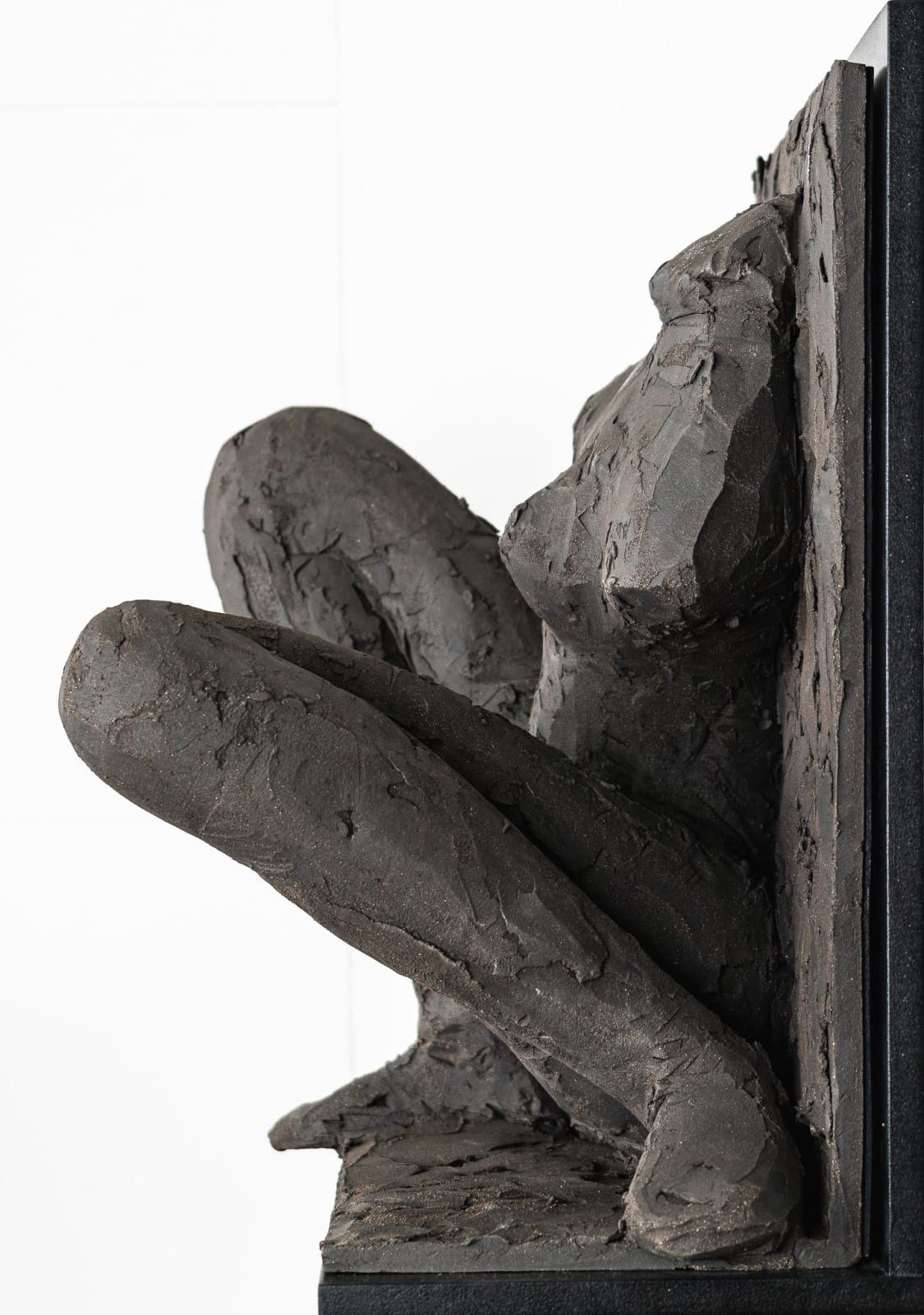 Ceramic relief in black clay in sculptor Emilio DiIorio's Women of Troy series.