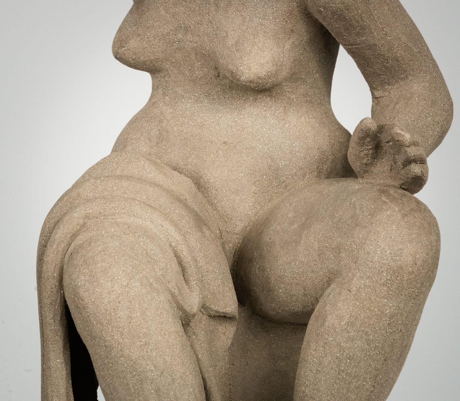 Figurative ceramics sculpture by artist Emilio DiIorio. Female figure is No. 4 in artist's Seated Bathers series in gray clay.