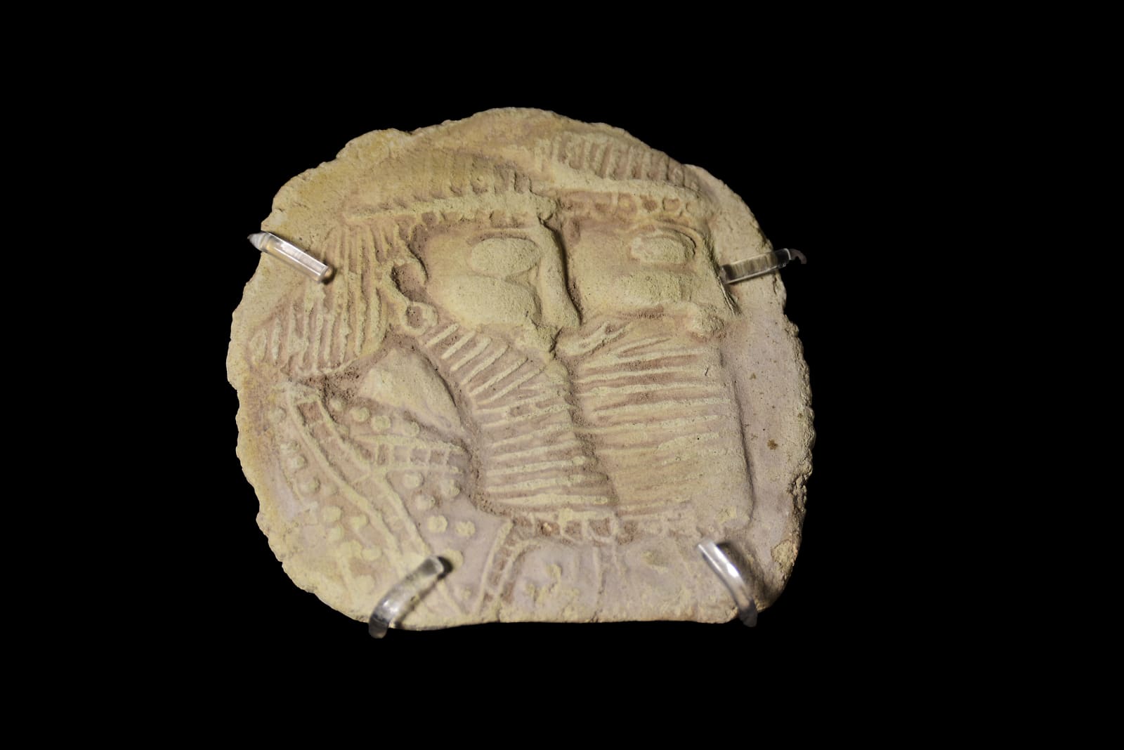 A Clay Plaque with Portrait of Two Bearded Men., Mesopotamia, circa 2nd millennium B.C.E.