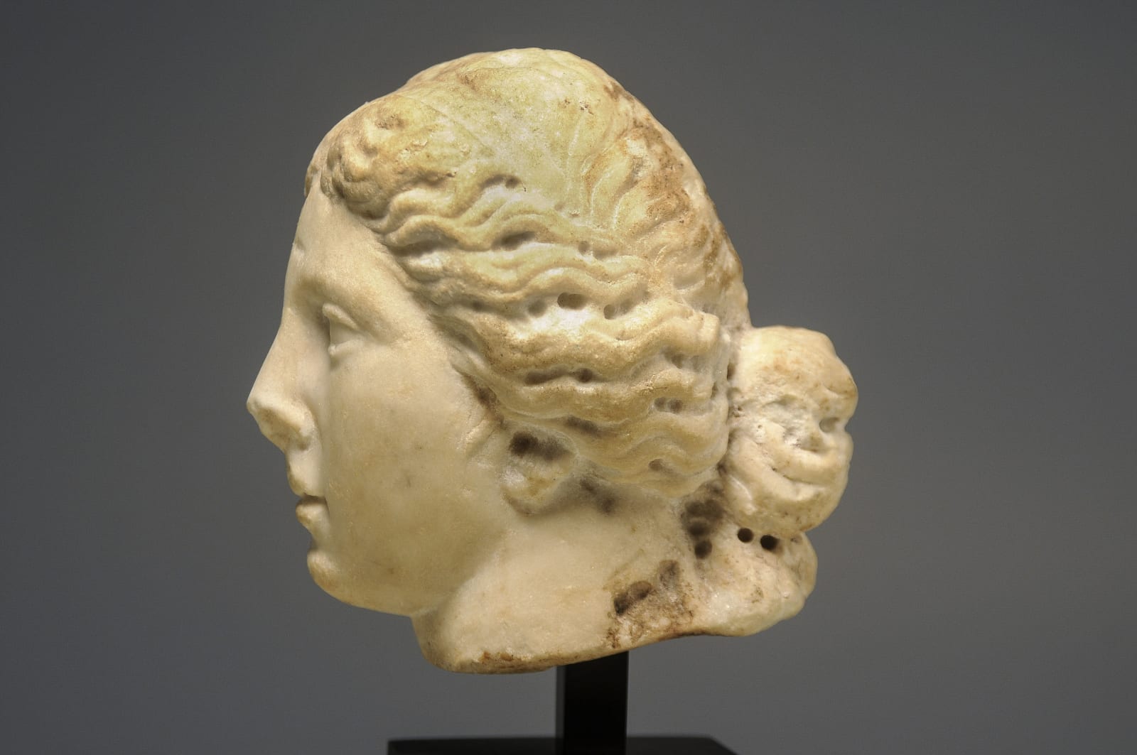 A Roman Imperial White Marble Head of Sphinx, Circa 100 A.D.