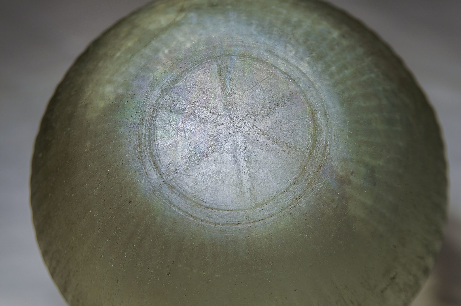 A Molded Green Glass Wine Bow, Greek, Hellenistic 300 B.C.E. – 200 B.C.E.