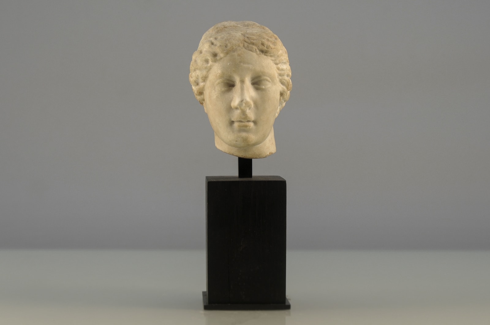 A Roman Imperial White Marble Head of Sphinx, Circa 100 A.D.