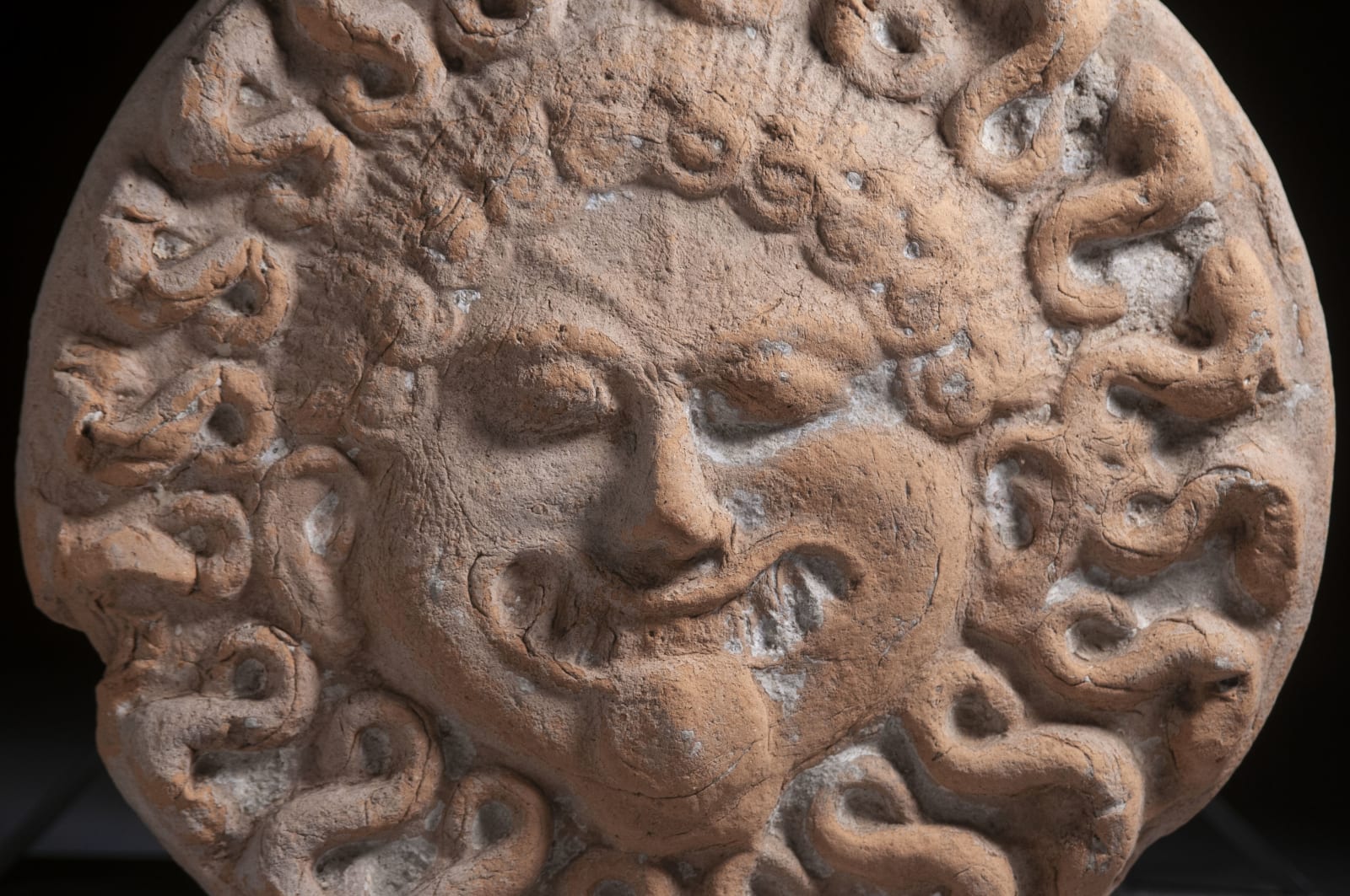 A Large Medmaeian Bust of Medusa, Greek Magna Graecia, Medma, Archaic Period, circa. 600 B.C.E.