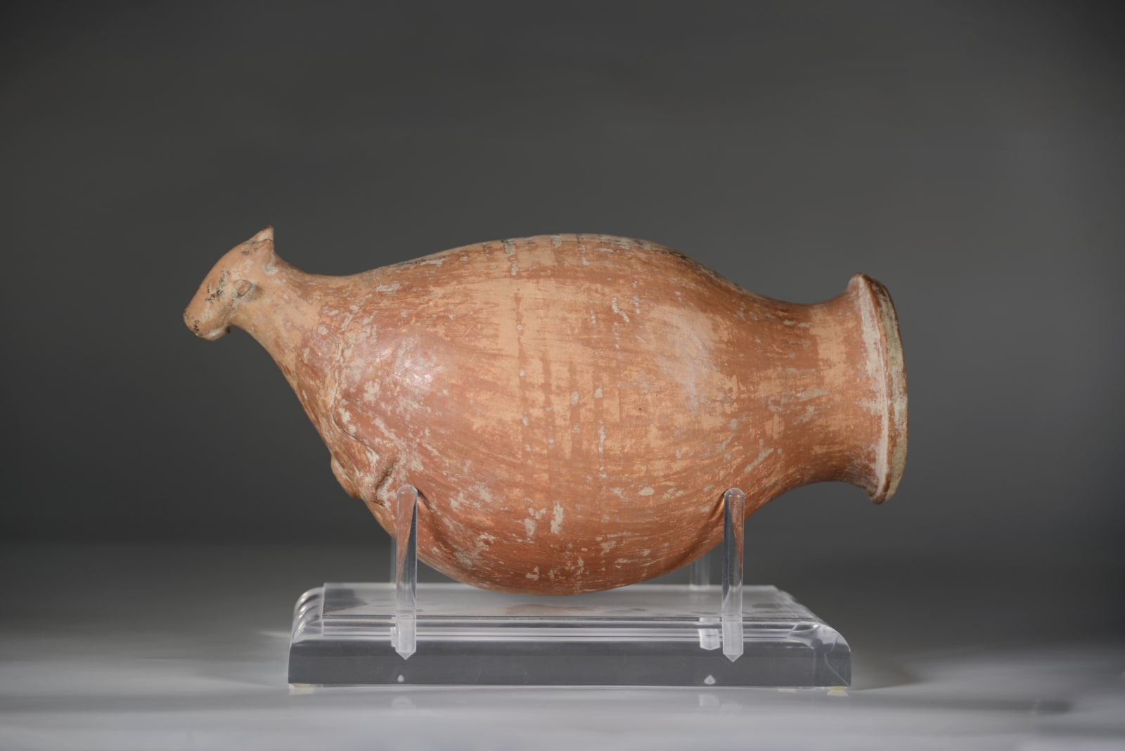 A Persian Red Slip Wine Pottery Rhyton, Circa Late 1st Millennium B.C.E.