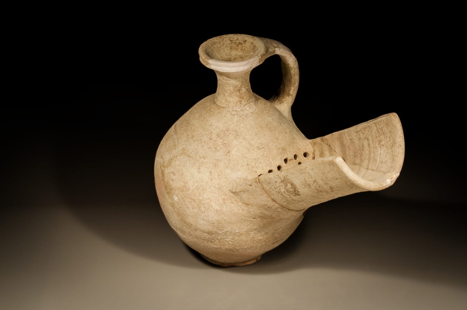 An Israelite/Judean Ceramic Wine Strainer, Iron Age II B, 900 B.C.E. - 800 B.C.E.