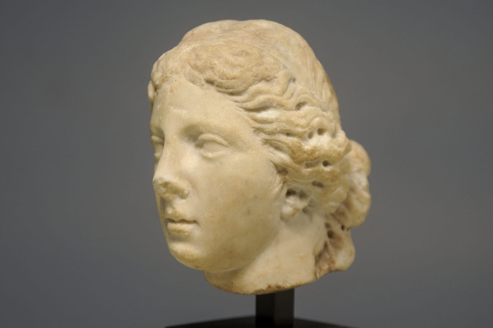 A Roman Imperial White Marble Head of Sphinx, Circa 100 A.D.