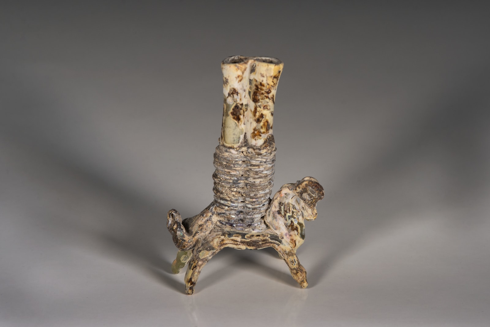 A Glass horse carrying double kohl flask, Islamic period 8th century C.E.