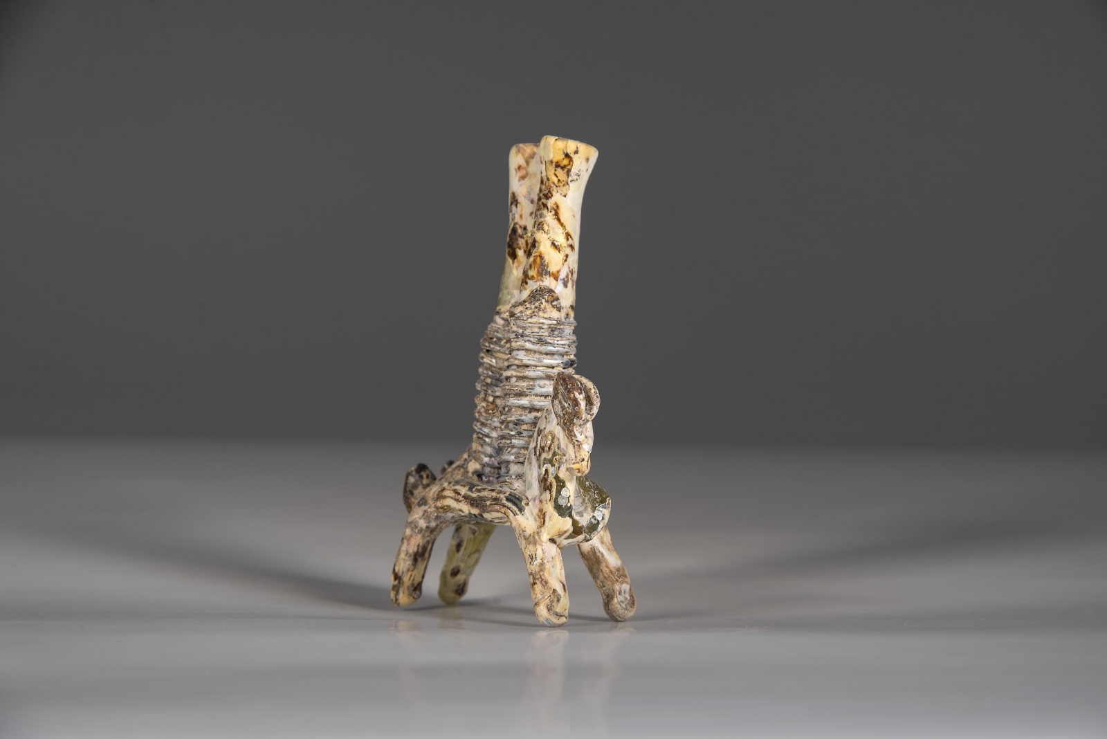 A Glass horse carrying double kohl flask, Islamic period 8th century C.E.