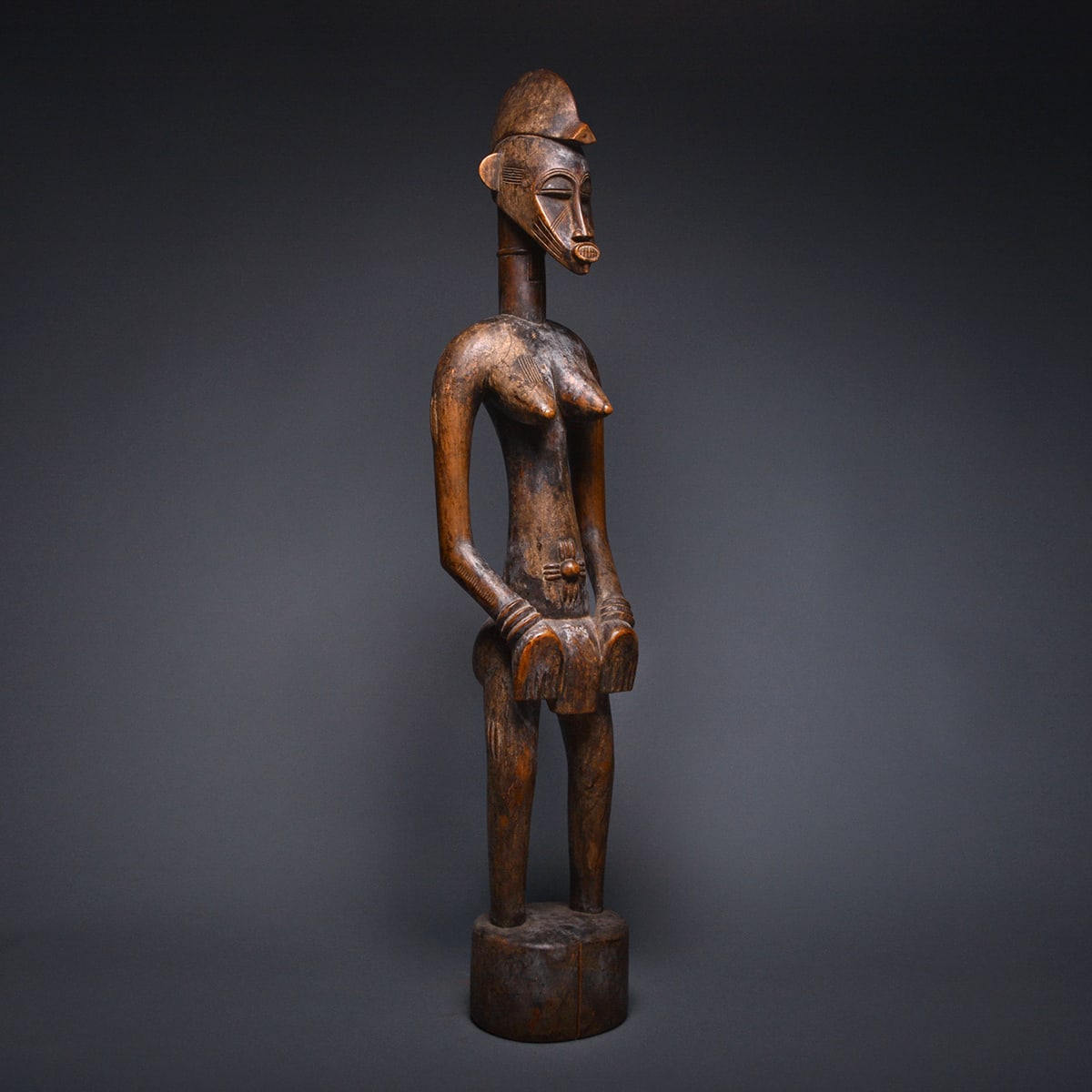 Female Senufo Wooden Pombilele Rhythm Pounder, 20th Century CE