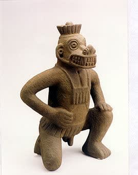 Kneeling Masked Figure Volcanic Stone, 700 CE - 1000 CE