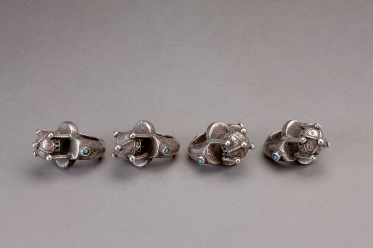 Five silver rings with a domical element and lapis lazuli stones
