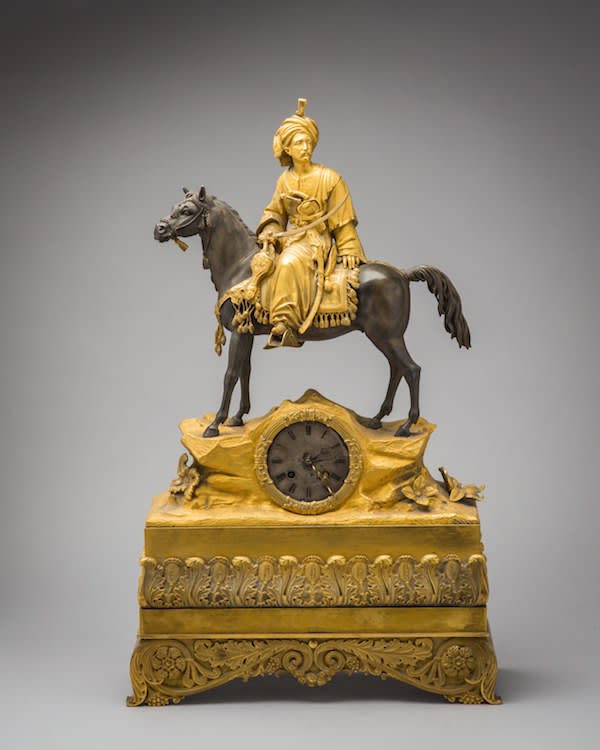 French ormolu and patinated bronze mantelpiece clock with a mounted fully armed soldier