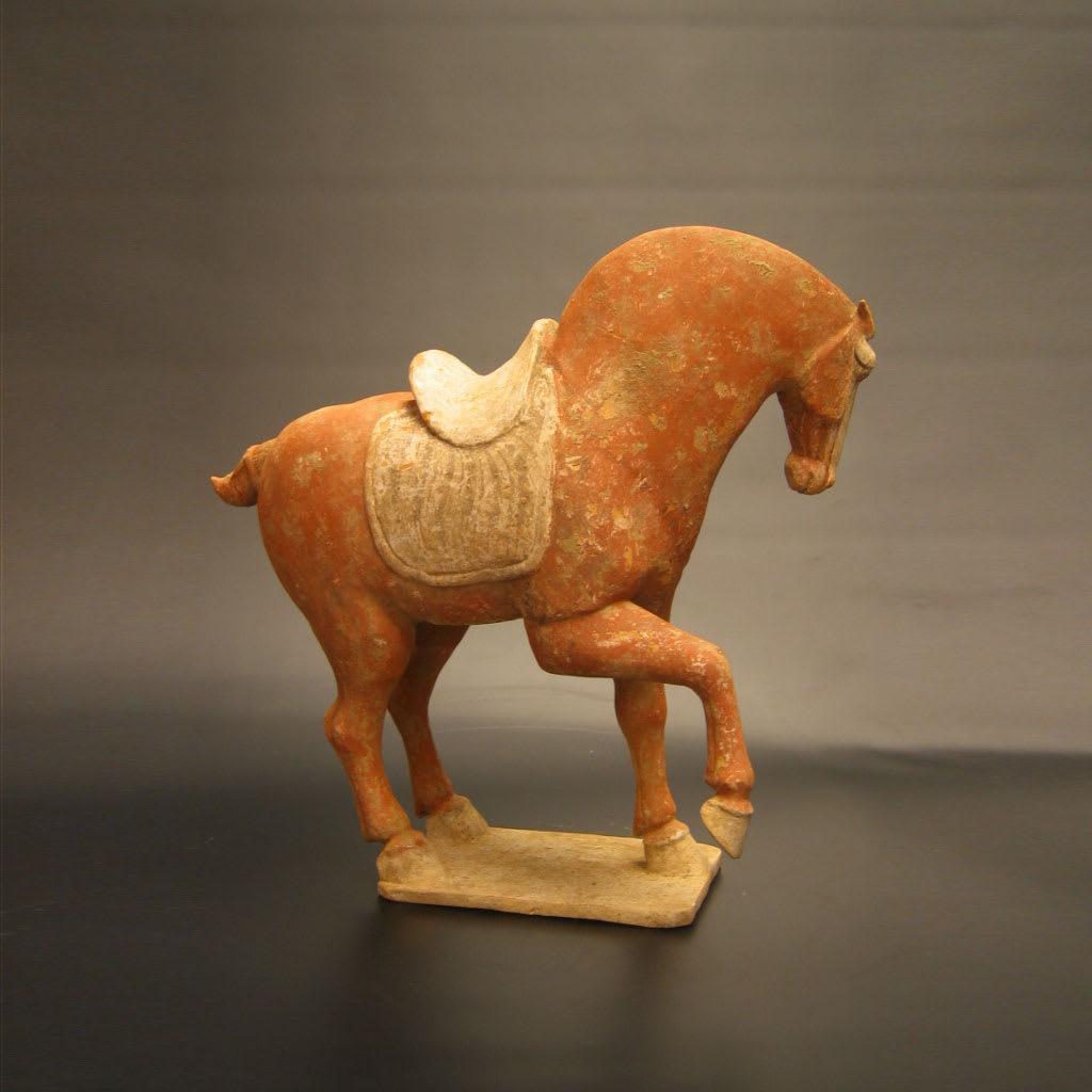 A Tang Dynasty Red Painted Pottery Prancing Horse, 618 CE - 907 CE
