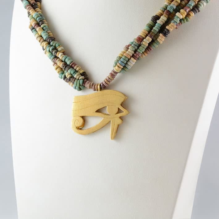 Five Strand Egyptian Faience Bead Necklace with a Gold Eye of Horus Pendant, 1900 BCE - 1100 BCE
