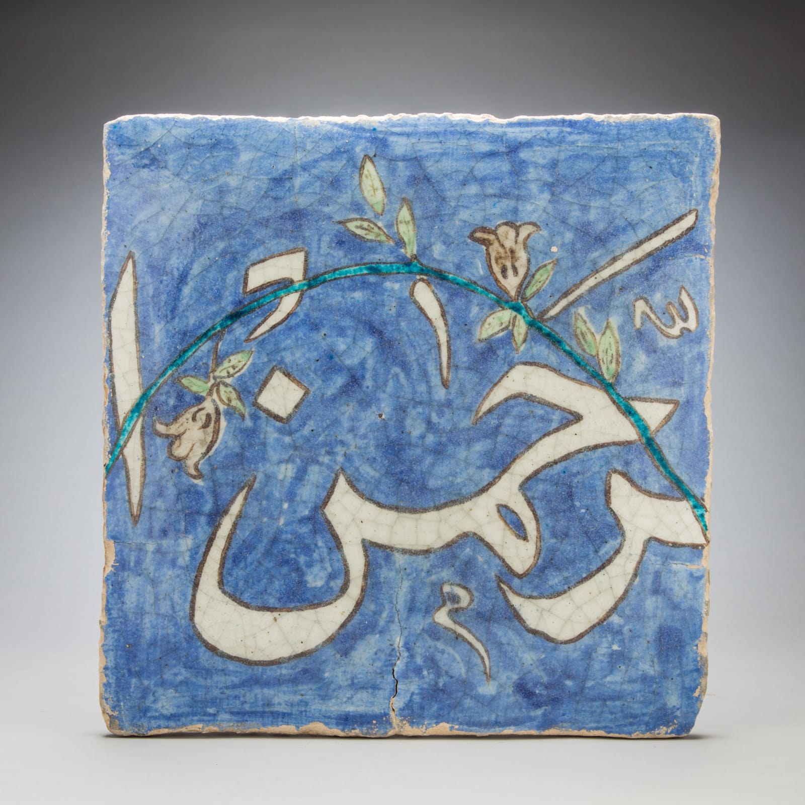 Series of Four Inscribed Safavid Tiles in Blue Glazed Background, 1600 CE to 1800 CE
