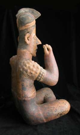 Ameca-Ezatlán Style Jalisco Sculpture of Seated Man Wearing Crested Helmet, 300 BCE - 300 CE