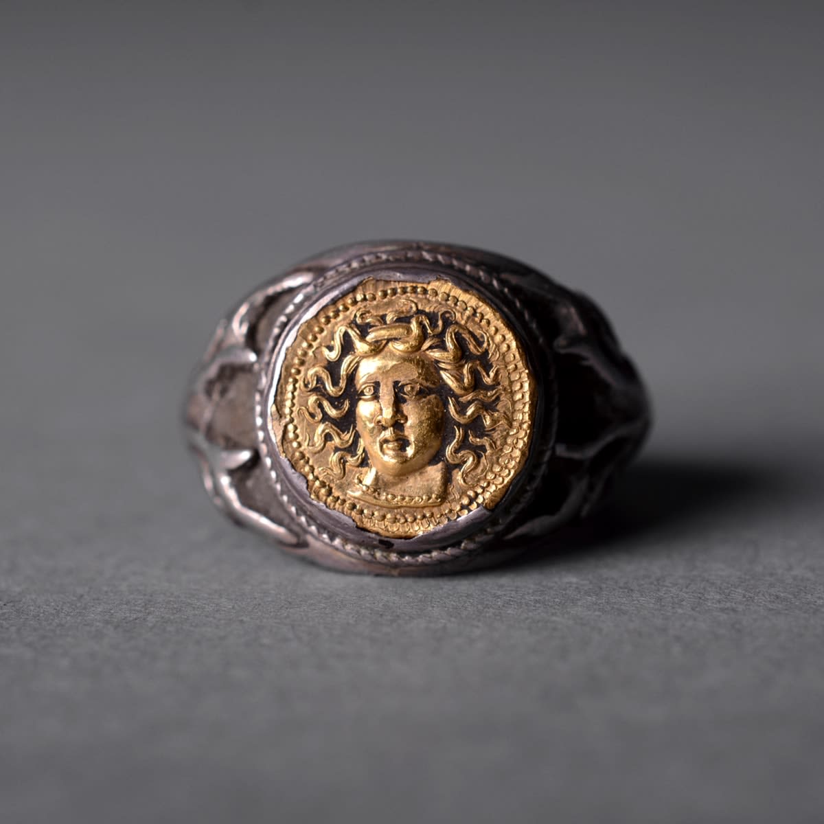Classical Revival Silver Ring Featuring a Gold Coin, 18th Century CE - 19th Century CE