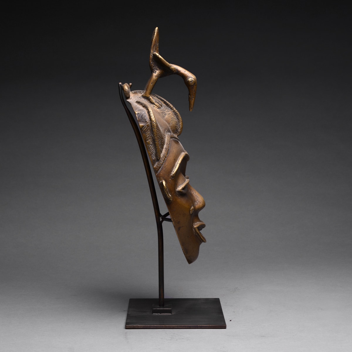 Baule Brass Face Mask Surmounted by a Bird, 20th Century CE