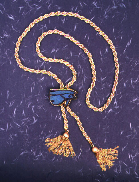 Gold Rope Chain Tassel Belt with a Gold Buckle Featuring a Faience Eye of Horus Amulet, 1600 BCE - 1100 BCE