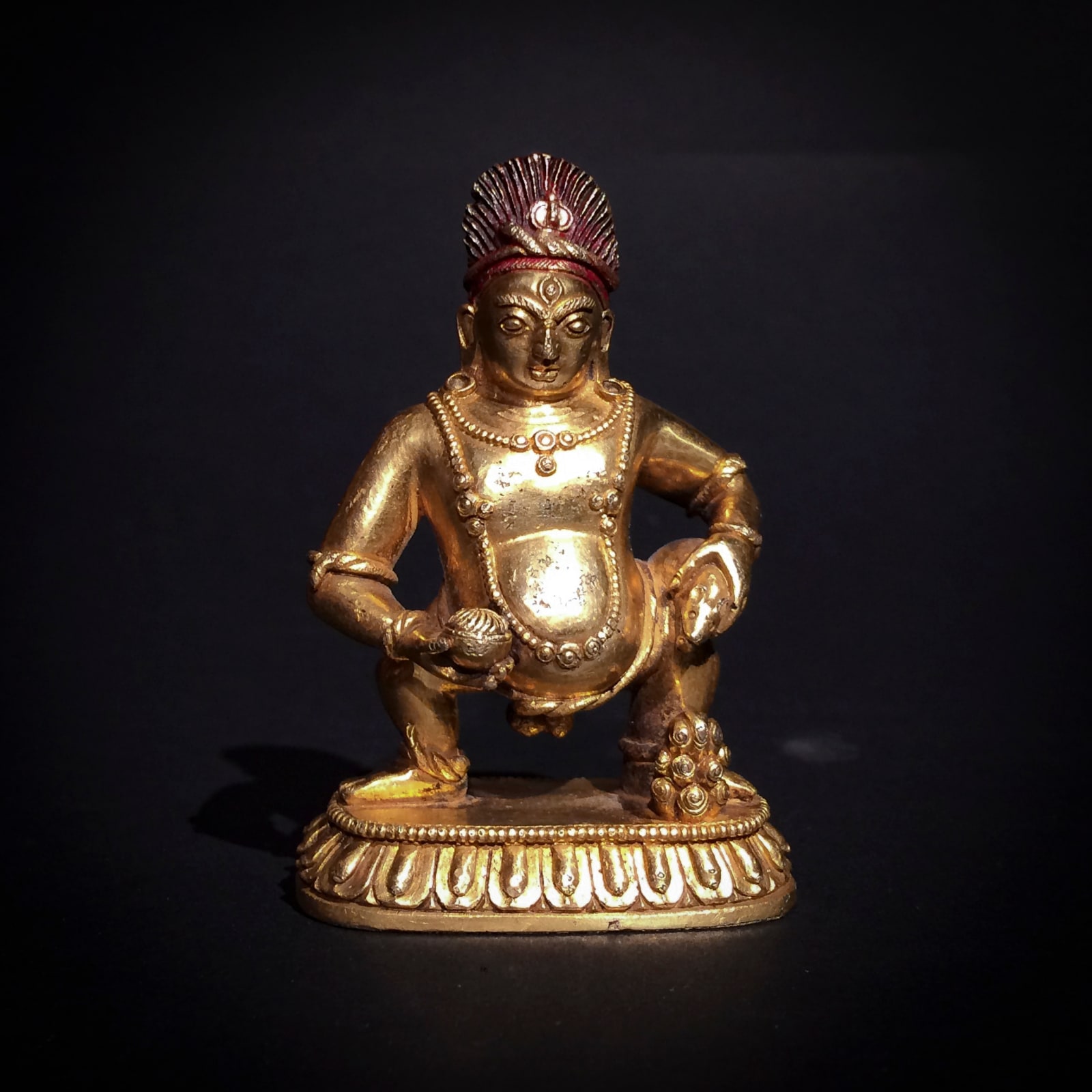 A gilt-alloy figure of Jambhala, 1700 - 1900 CE