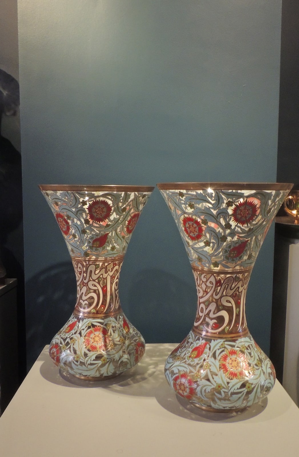 Pair of enamelled glass vases with floral decoration and islamic inscriptions, 19th Century CE