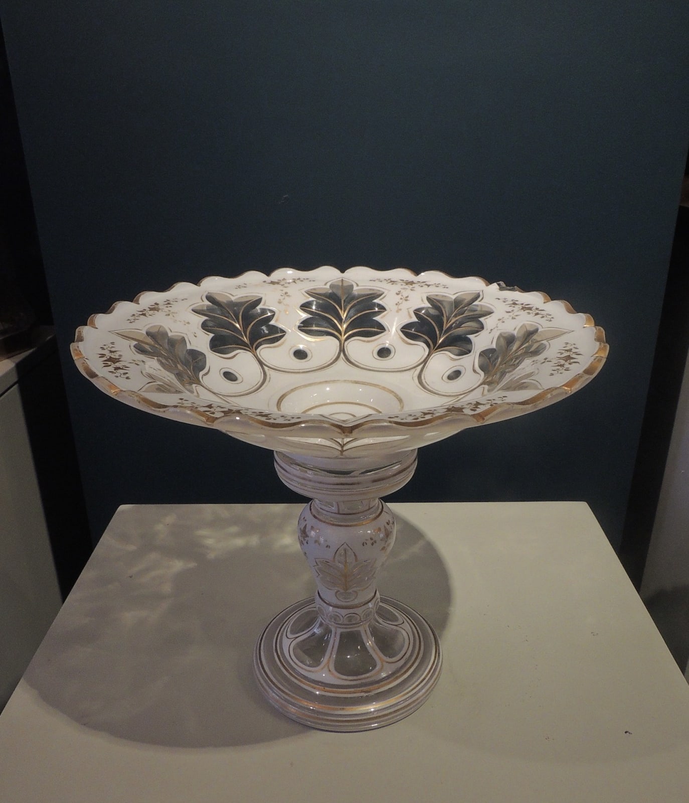 Transparent glass open form fruit bowl on stand