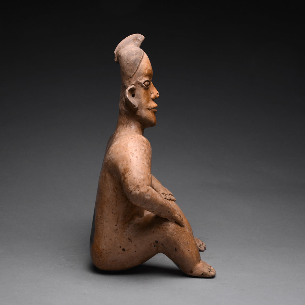 Ameca-Ezatlán Style Jalisco Terracotta Sculpture of a Seated Man, 300 BCE - 300 CE