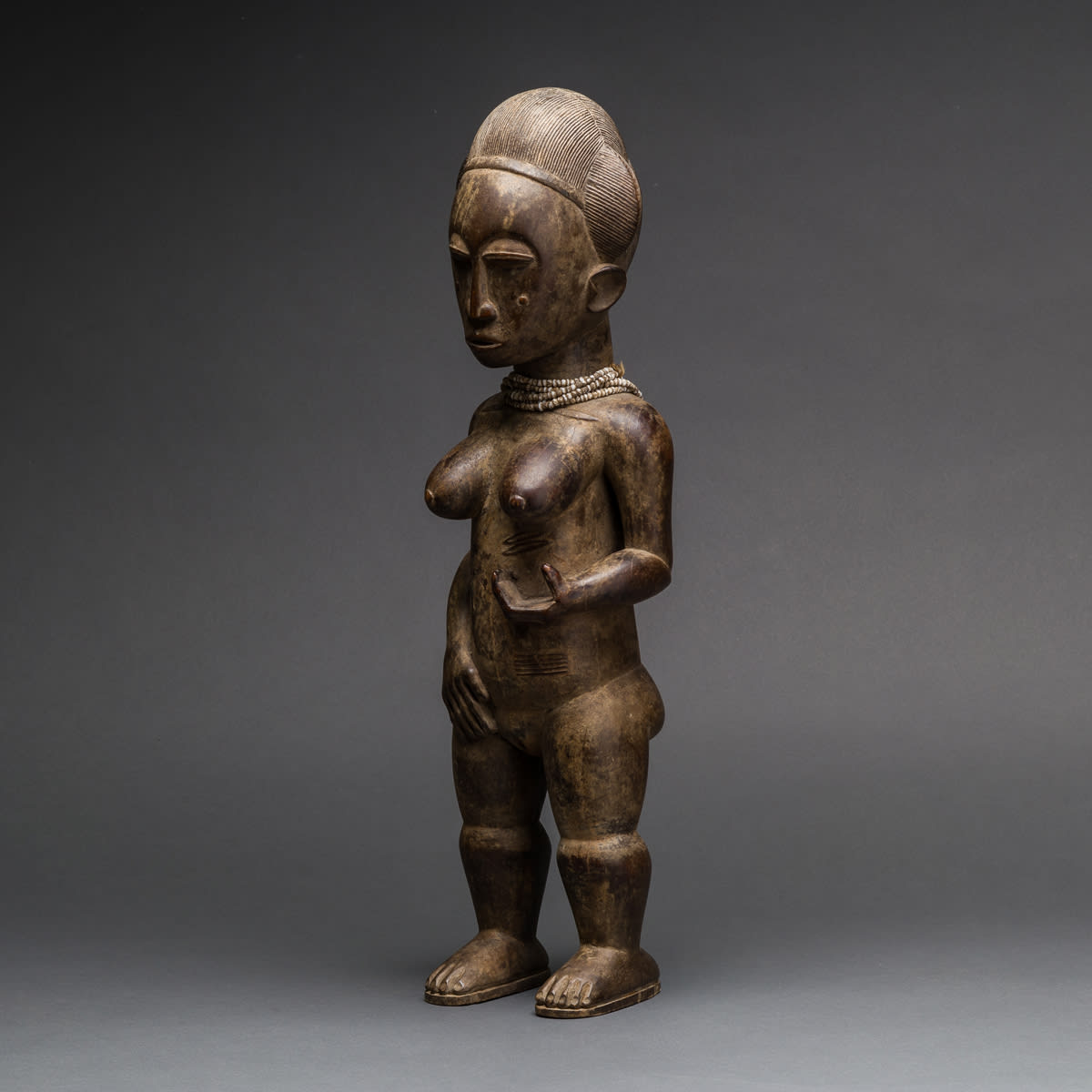 Baule Wooden Sculpture of a Woman, 20th Century CE