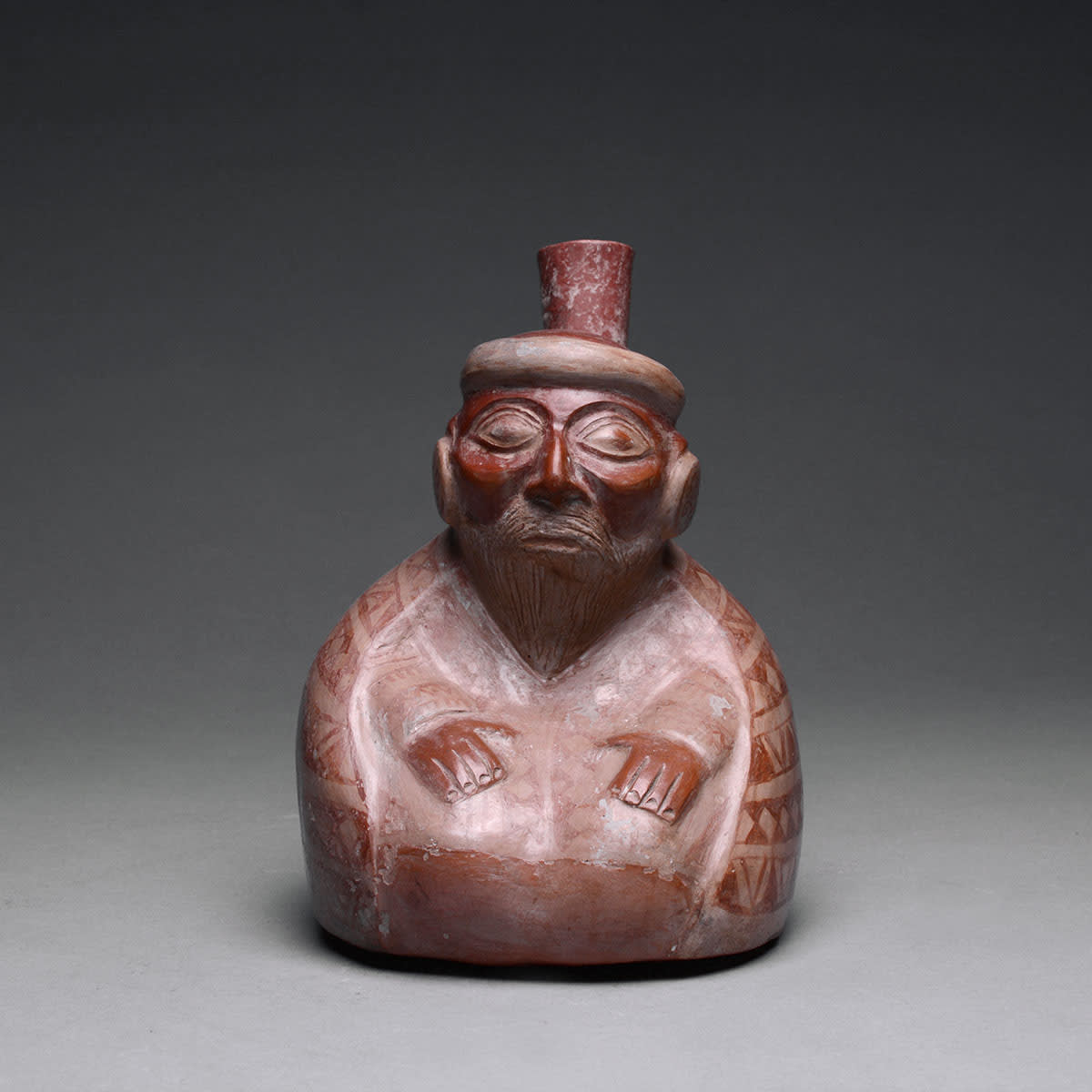 Moche Stirrup Vessel Depicting an Elderly Seated Male, 200 BCE - 200 CE