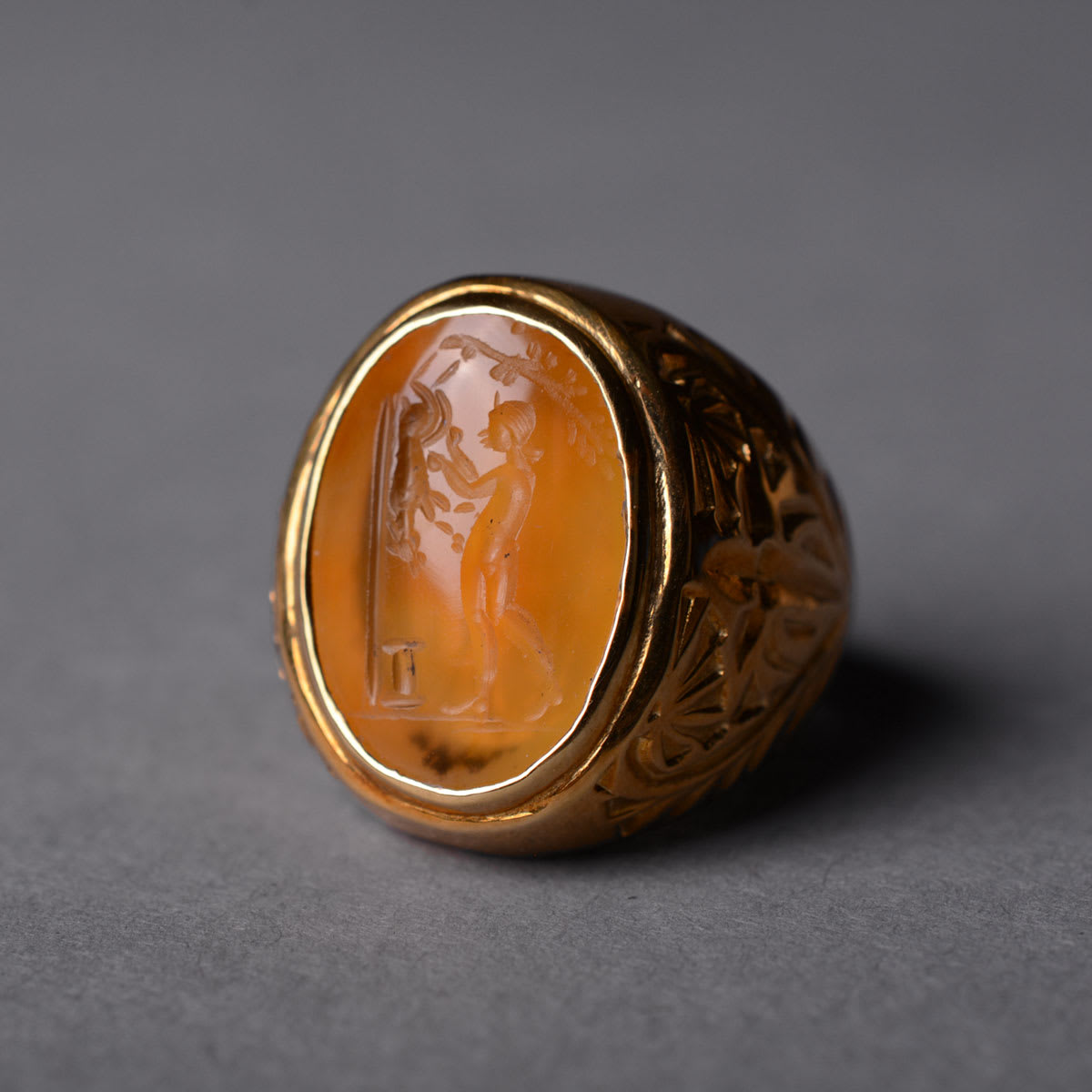 Roman Carnelian Intaglio Depicting a Man Flaying an animal, 100 CE - 300 CE