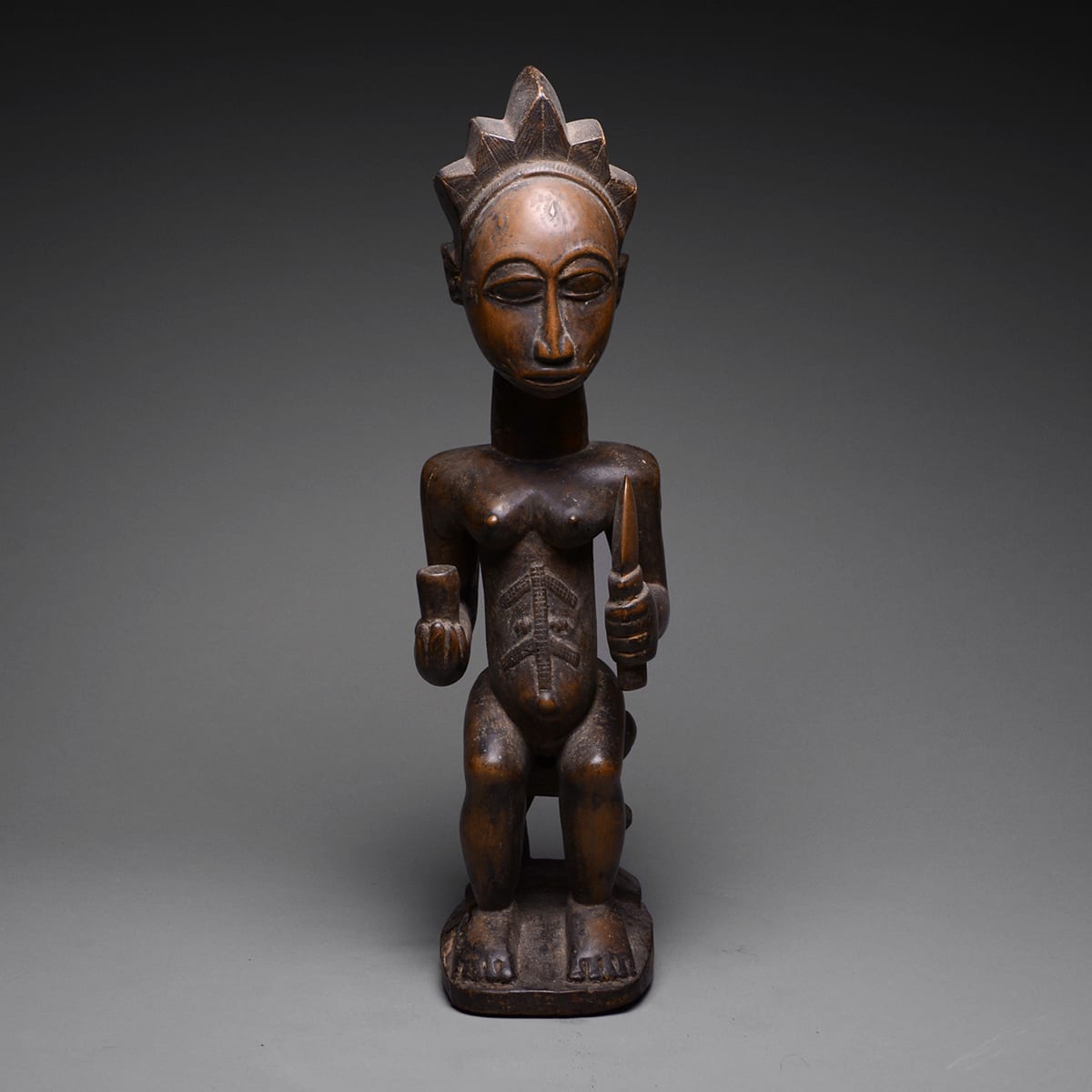 Baule Wooden Sculpture of a Seated Woman, 20th Century CE
