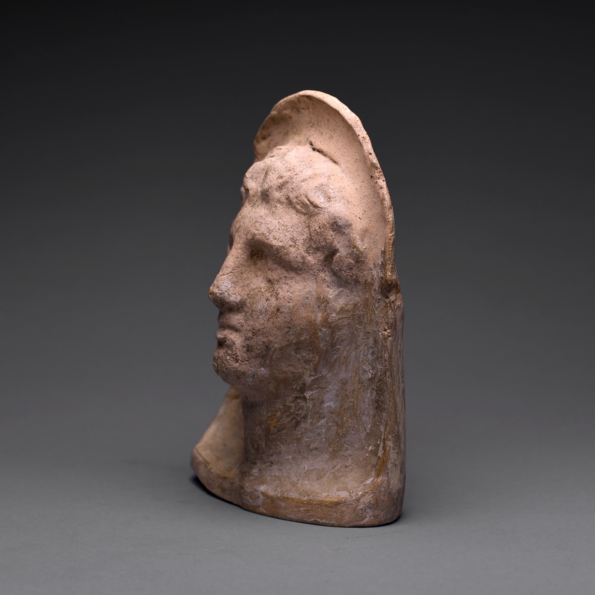 An Etruscan Terracotta Votive Head of a Youthful Man, 4th Century BC to 3rd Century BC