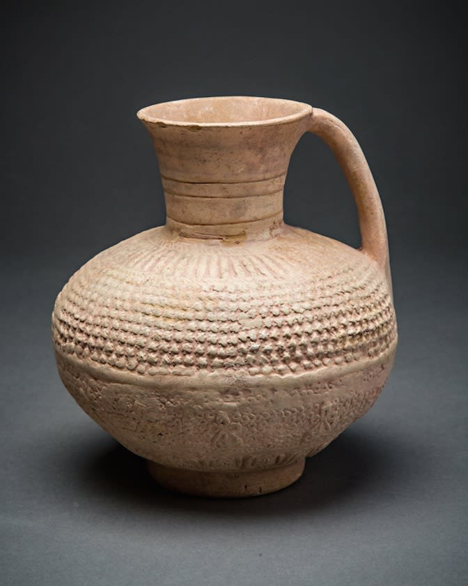 Globular unglazed terracotta jug