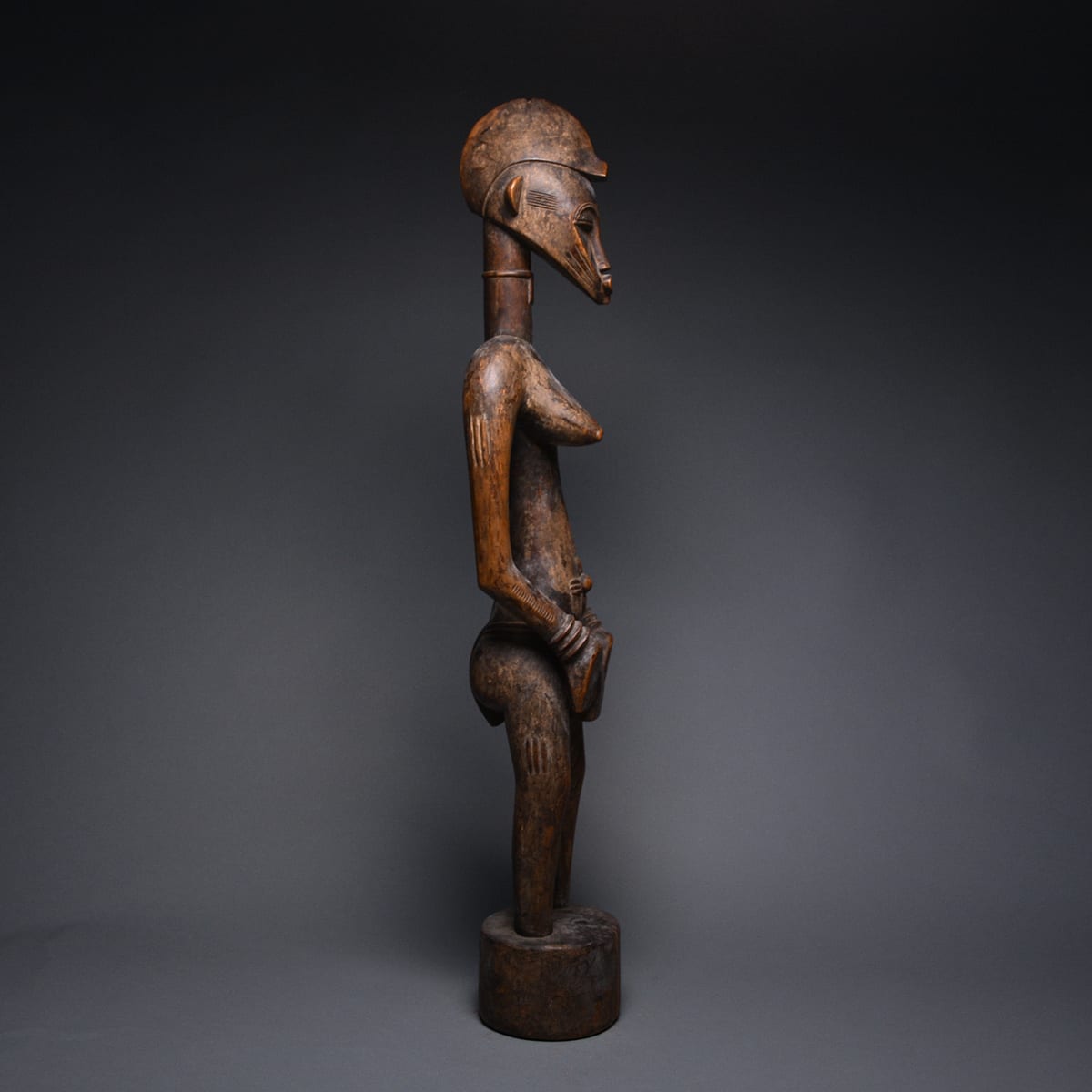 Female Senufo Wooden Pombilele Rhythm Pounder, 20th Century CE
