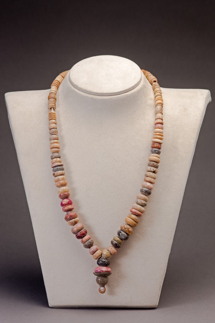 Necklace composed of large carved beads ofvarious periods, 600 BCE - 1200 CE