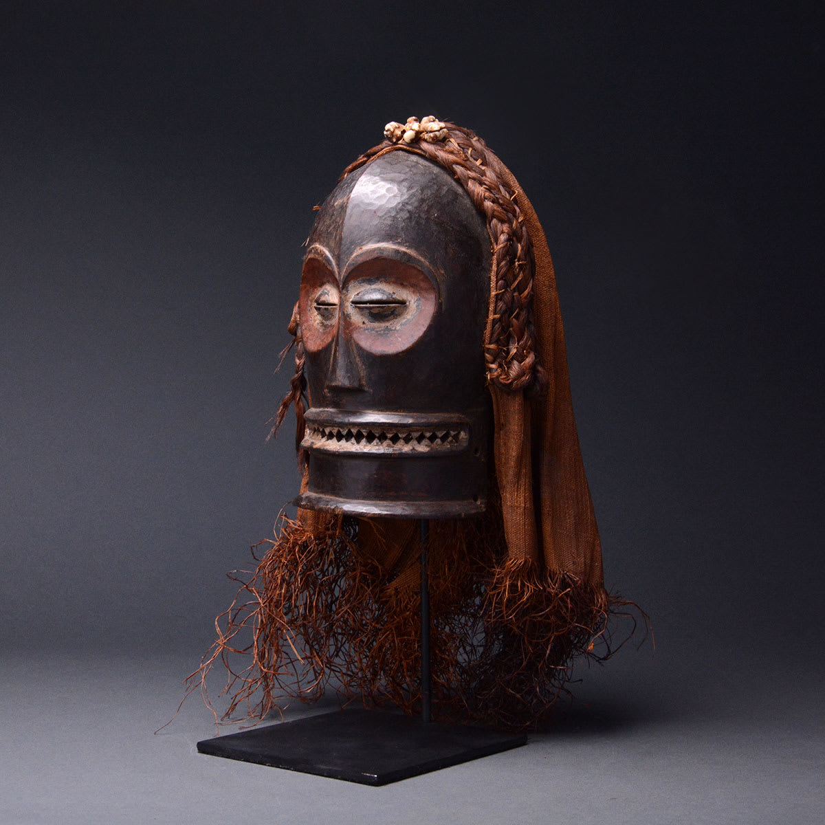 Chokwe Wooden Cihongo Mask with Cloth and Raffia Fibers, 20th Century CE