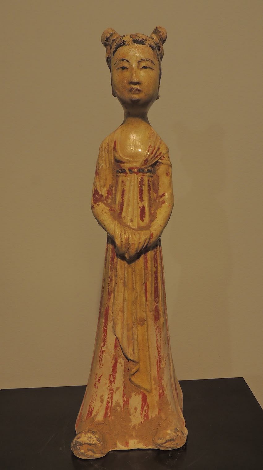 Sui period (581-618 AD) ochre-glazed terracotta figurine of a standing female court attendant, 581 CE - 618 CE