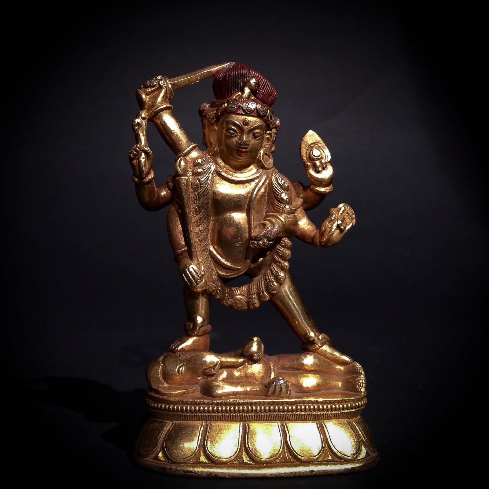 Gilt-alloy sculpture of three-headed Parvati standing astride Ganesha, c.1700 - 1900