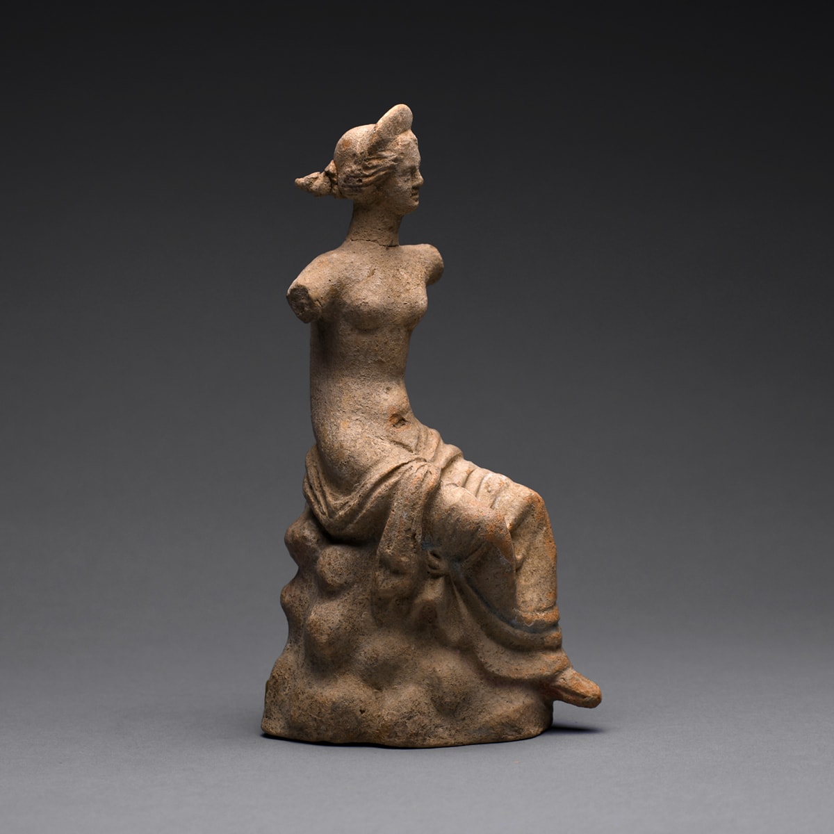 A Hellenistic Terracotta Statue of a Seated Woman
