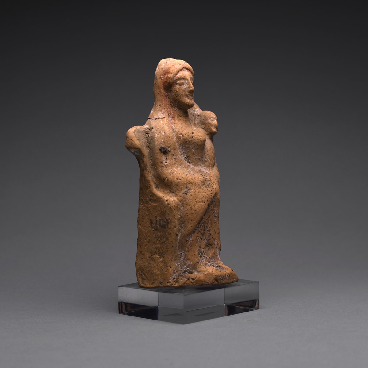 A Hellenistic Terracotta Statue of a Seated Woman