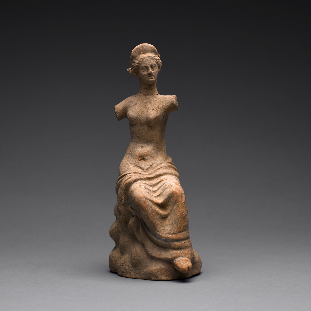 A Hellenistic Terracotta Statue of a Seated Woman