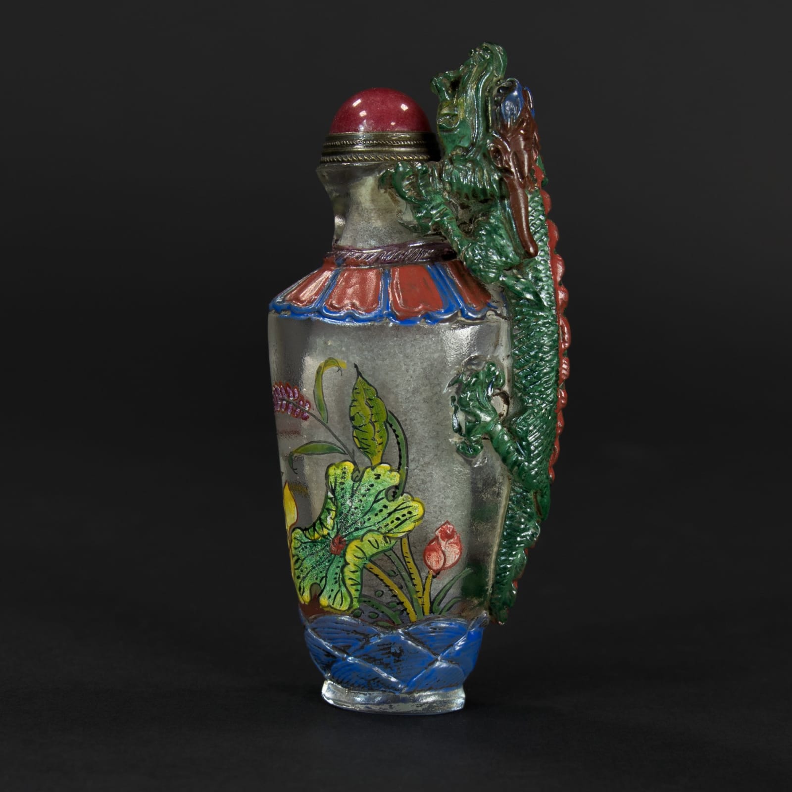 Peking glass Snuff Bottle with a Carnelian lid and dragon, 1644 AD to 1912 AD
