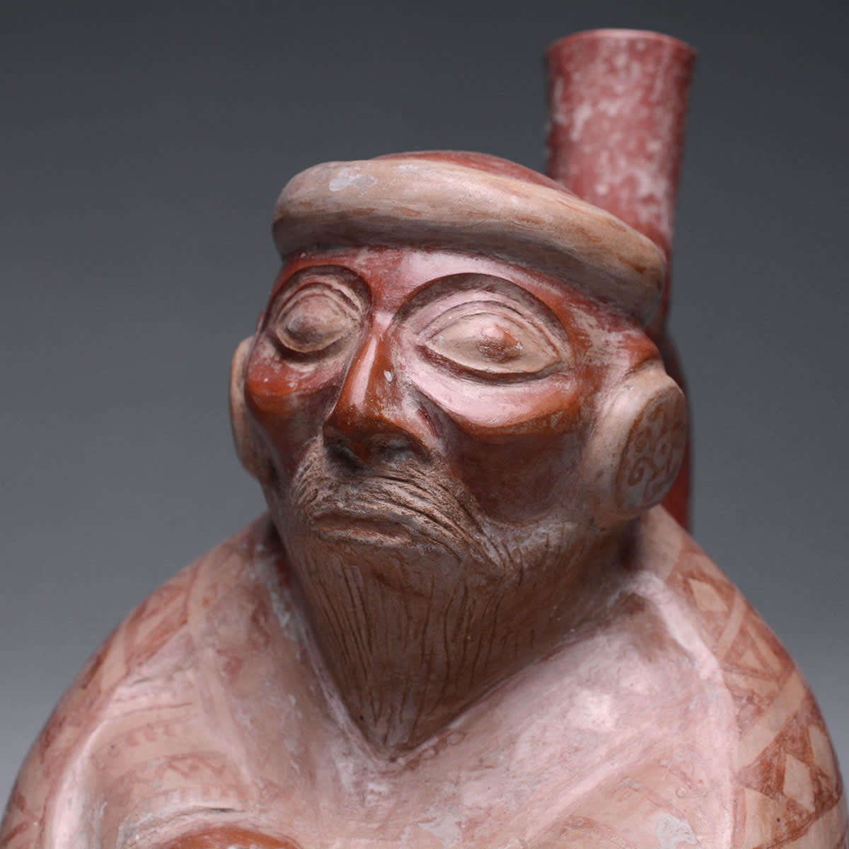 Moche Stirrup Vessel Depicting an Elderly Seated Male, 200 BCE - 200 CE